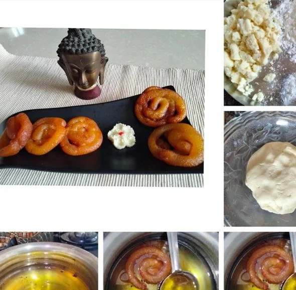 Mawa jalebi arranged on a black slate board beside a small bowl of rabri