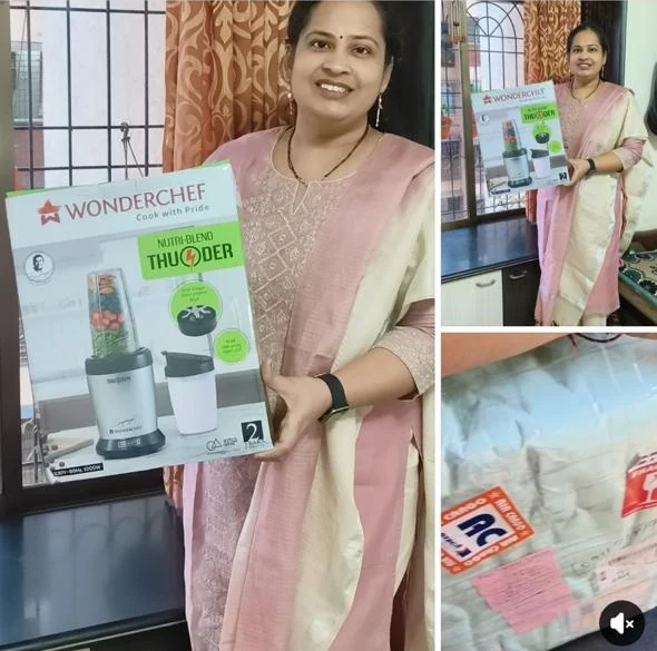 Hema Banare Shet holding her Wonderchef Nutriblend Thunder mixer grinder box at home