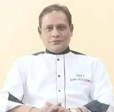 Chef Dominic Gomes in his chef jacket